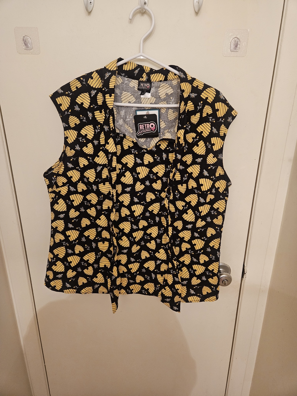 Retrolicious Black and Yellow Sleeveless Top with Playful Print